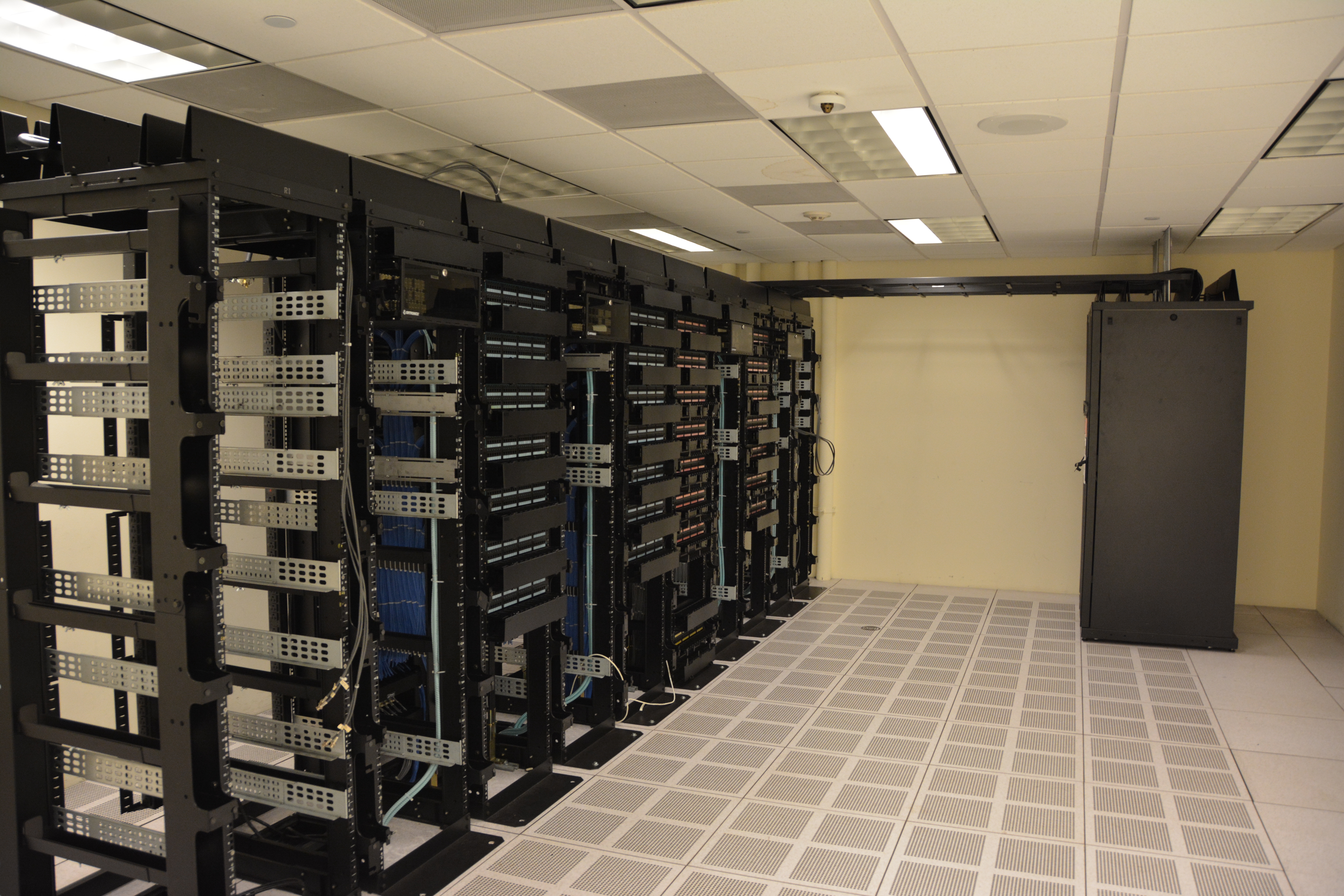 Server racks in a data center, photographed in 2015.